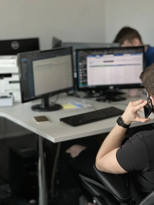 A CT Connect freight forwarder talking to a client on the phone
